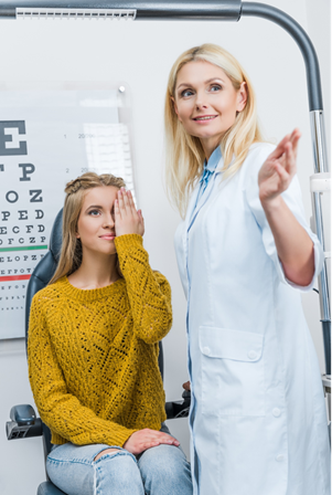 Ophthalmologist examines a patient.