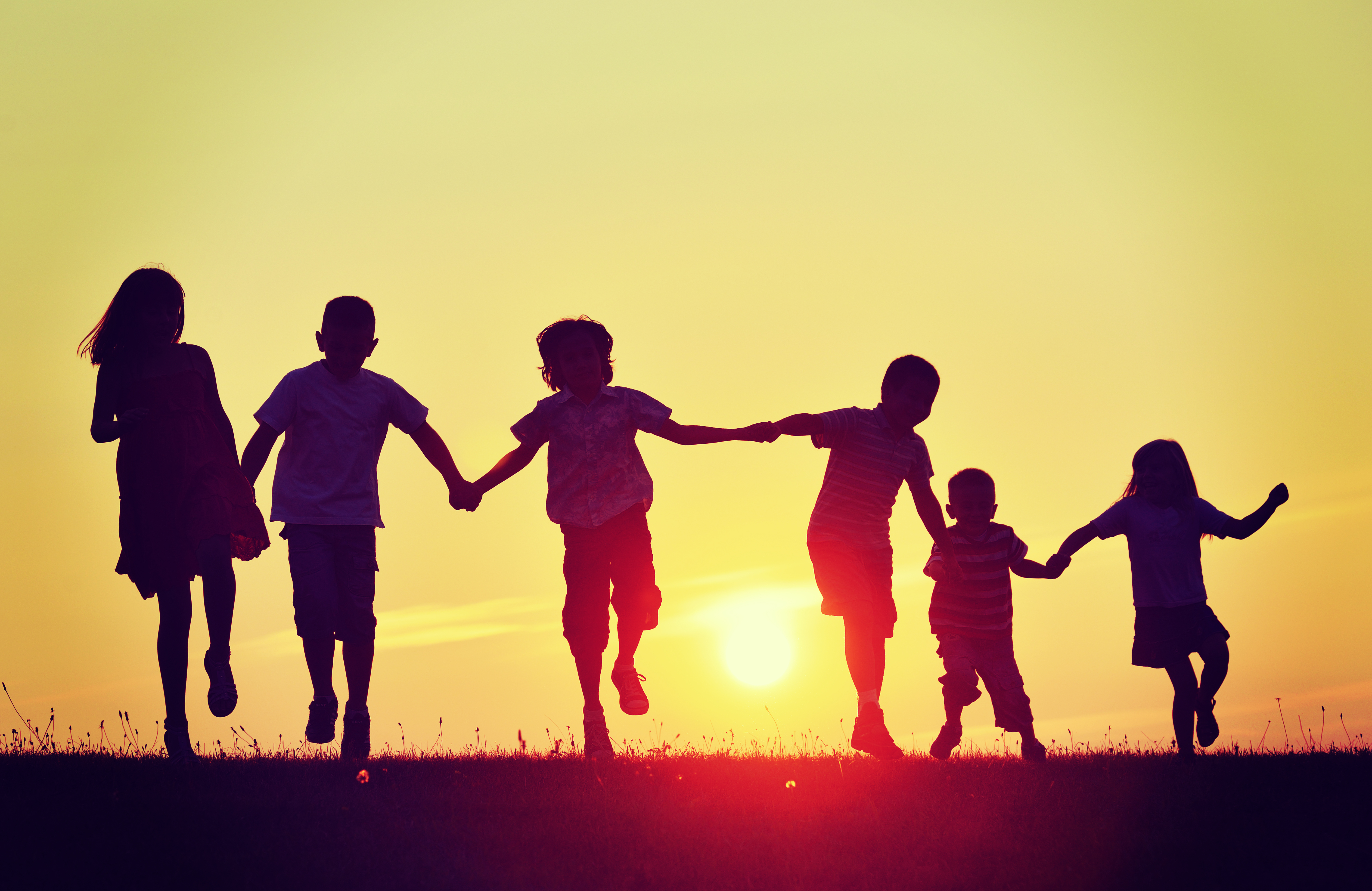 kids in sunset shutterstock_283034996.jpg