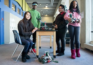 Four high school students and the robots they designed