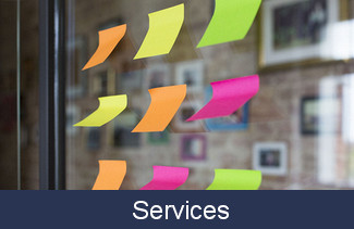 Picture of sticky notes and Services banner