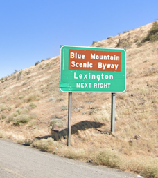 Sign for Blue Mountain Scenic Byway and Lexington for Exit 147.