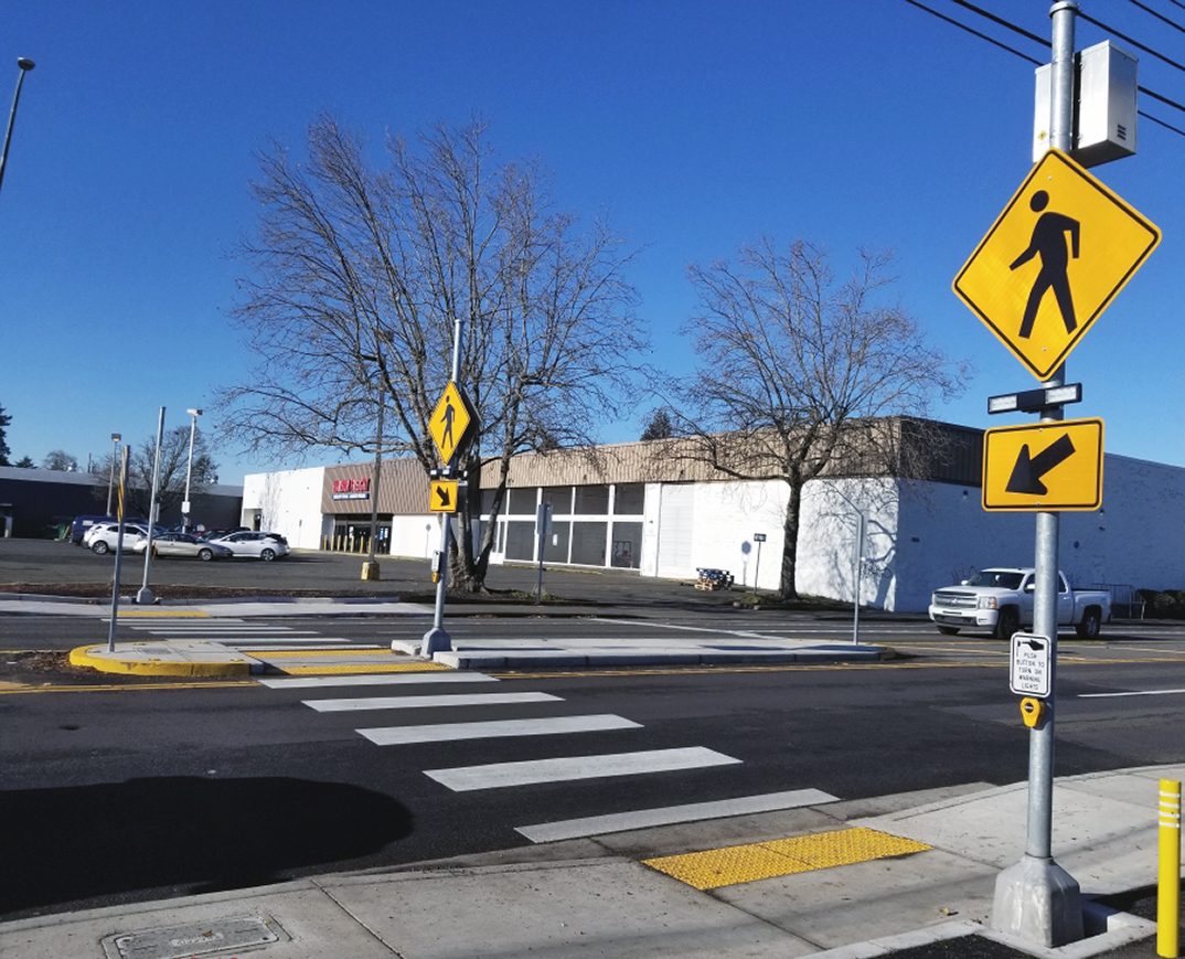 Example photo of an upgraded crosswalk with a Rectangular Rapid Flashing Beacon, or RRFB.