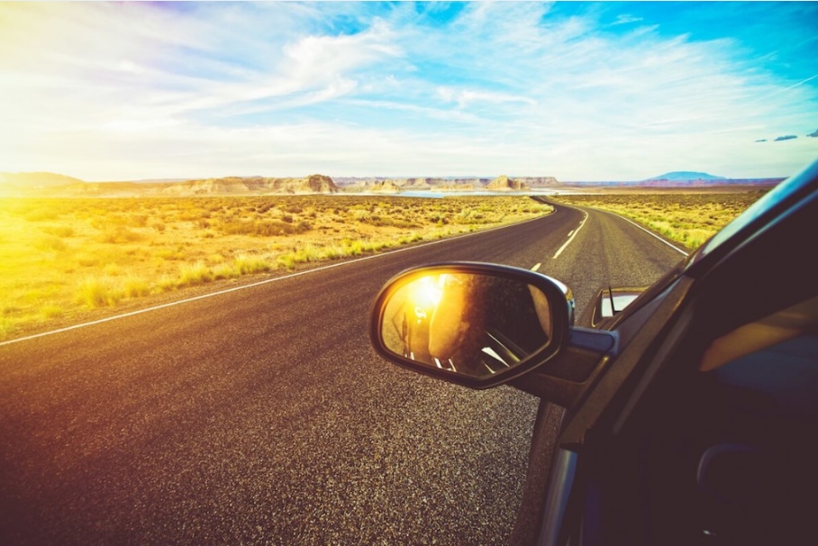 Car driving in the sun.