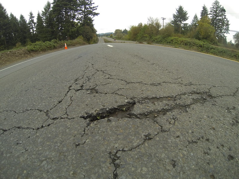 An image showing cracks and holds in an Oregon roadway