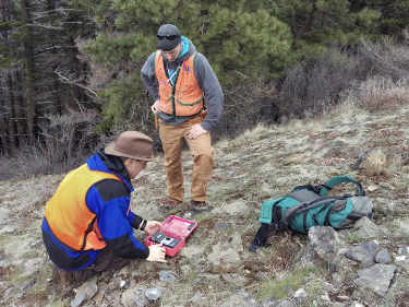 Image of geologists taking samples