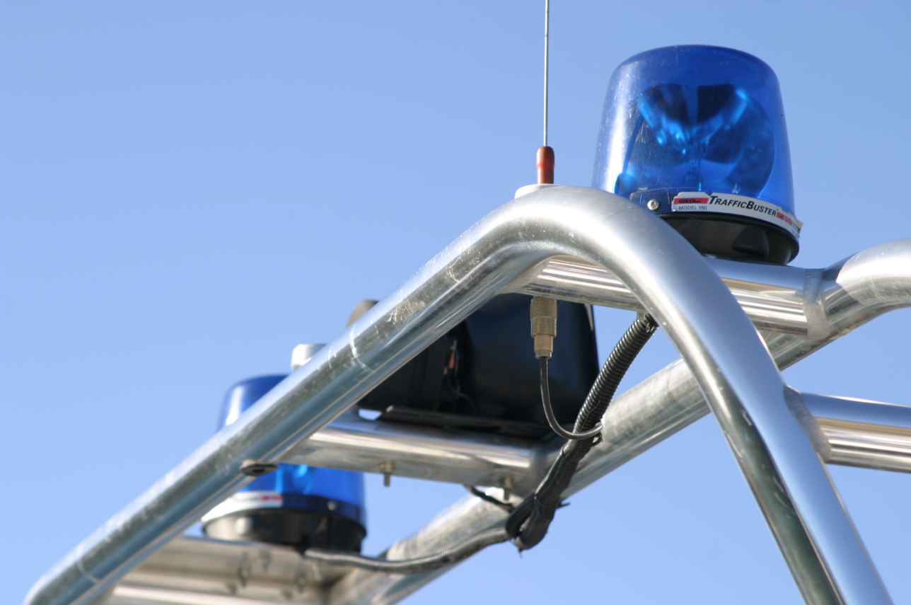 Blue light atop a marine law enforcement boat frame